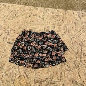 Black skort with flowers and bow in front